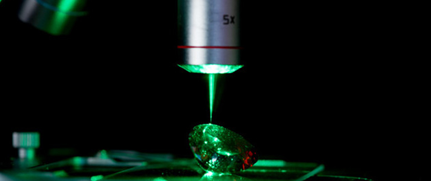 Raman spectroscopy being used to analyze a gemstone